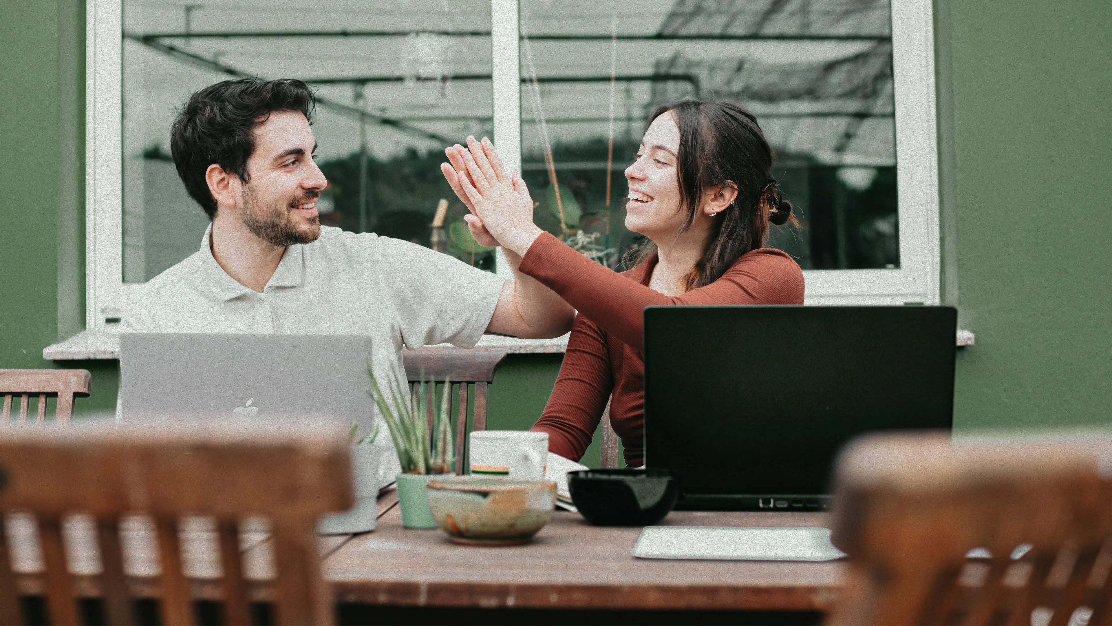 An open Bible resting on a wooden surface